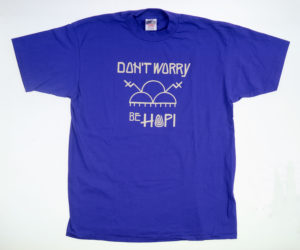 Blue t-shirt with white slogan: Don't worry, be Hopi