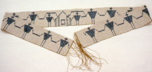 White beaded belt with blue figures
