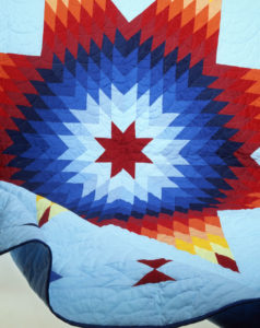 Vibrant quilt in primary colors of a star pattern