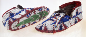 Pair of colorful, woven moccasin shoes