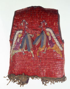 Red vest with colorful figural designs